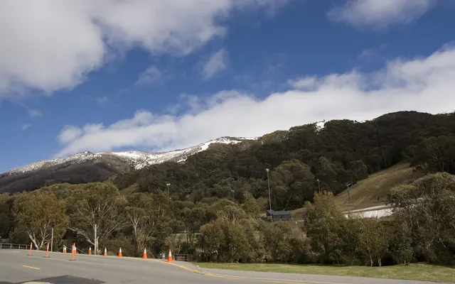 Thredbo village and the ski slopes, with snow on the peaks