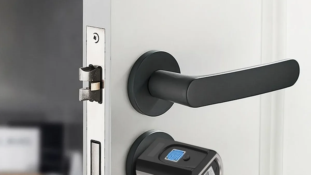 A fingerprint smart lock on a white door