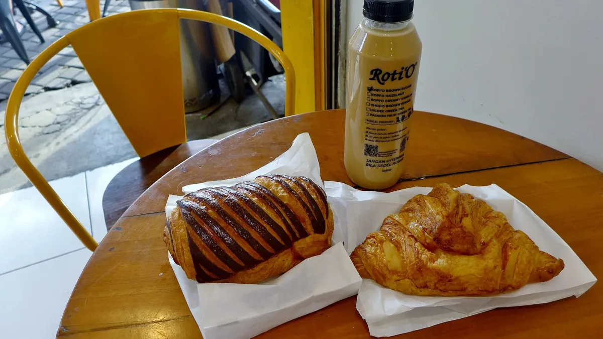 Pastries and coffee arranged on a cafe table