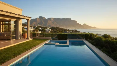 Cape Town Table Mountain with luxury villas on clifftop overlooking Atlantic