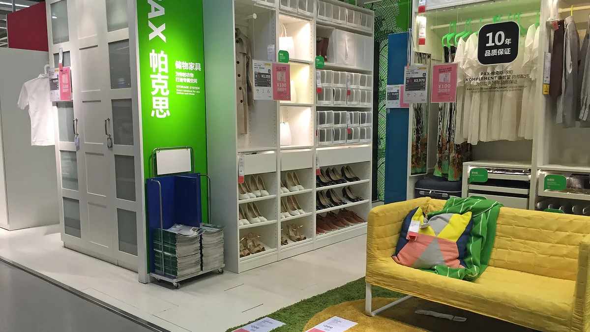 A wardrobe and sofa display inside an IKEA showroom