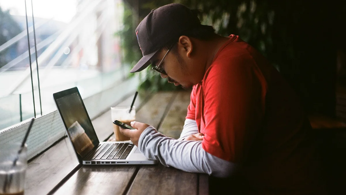 A traveler planning a trip on a laptop — where the booking journey now begins