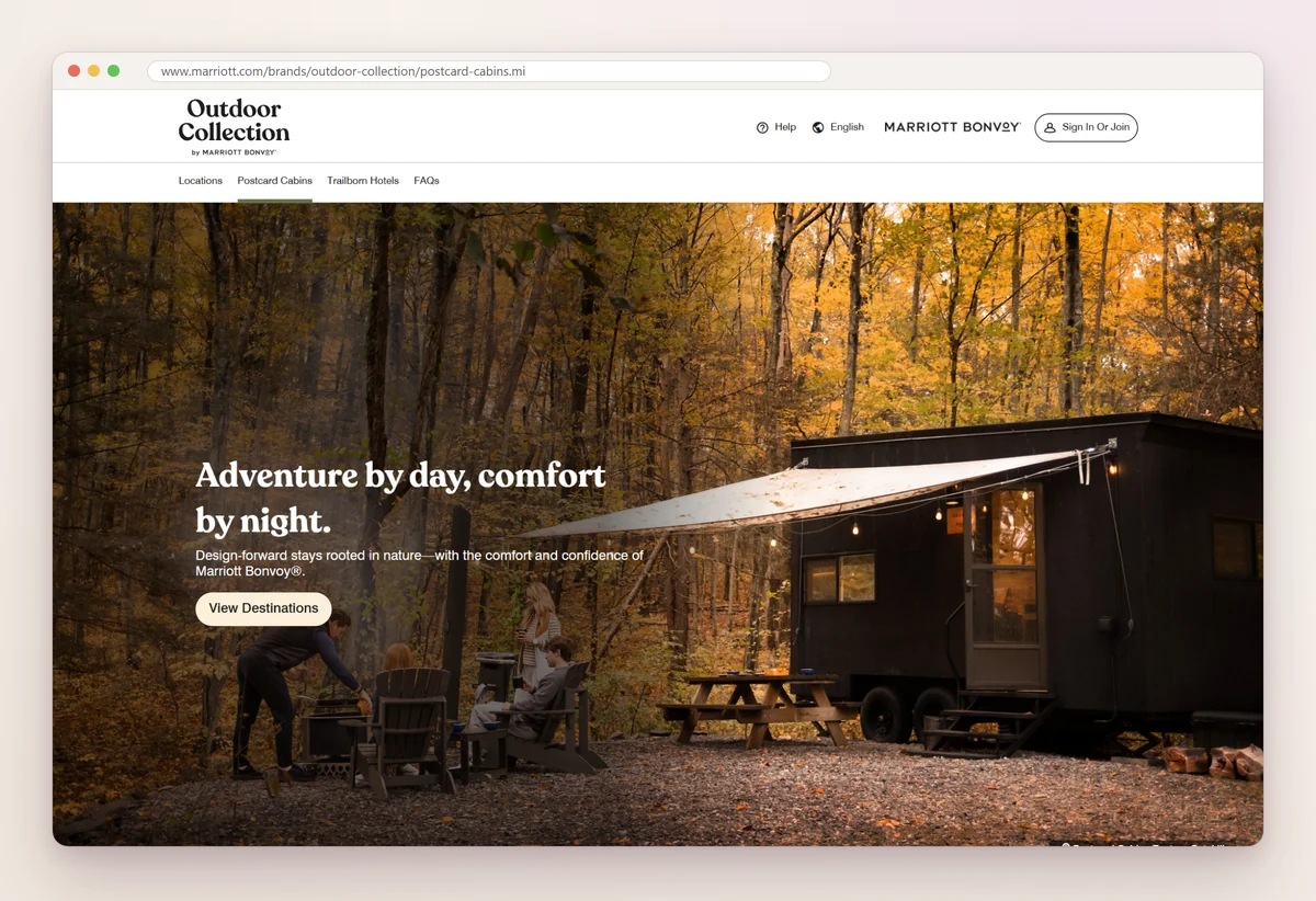 Outdoor Collection by Marriott Bonvoy page for Postcard Cabins, with a black cabin in autumn woods and the line Adventure by day, comfort by night