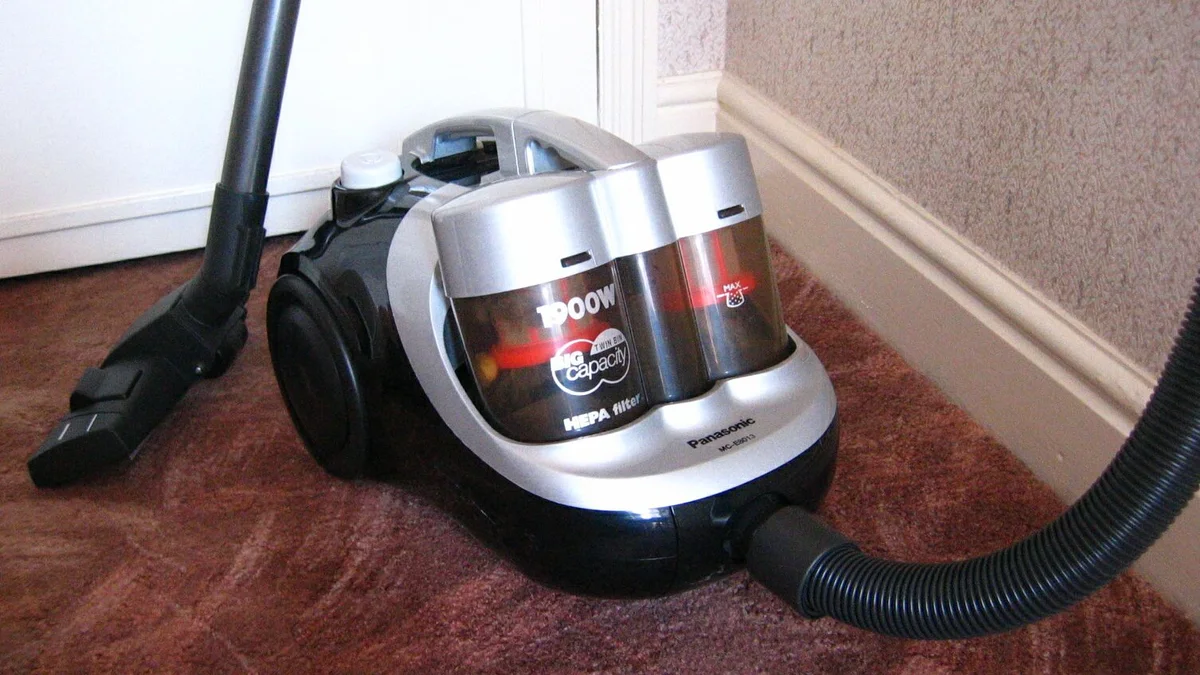 Close-up of a vacuum cleaner head on carpet