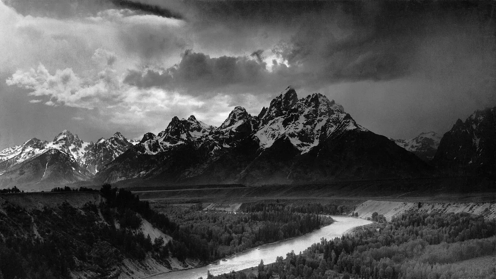 Ansel Adams's black-and-white photograph The Tetons and the Snake River, with the river curving toward the jagged Teton range under dramatic storm light