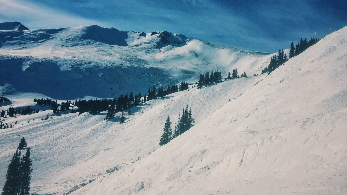 Groomed slopes at a mountain resort — proximity to the lifts is the ranking factor guests filter for