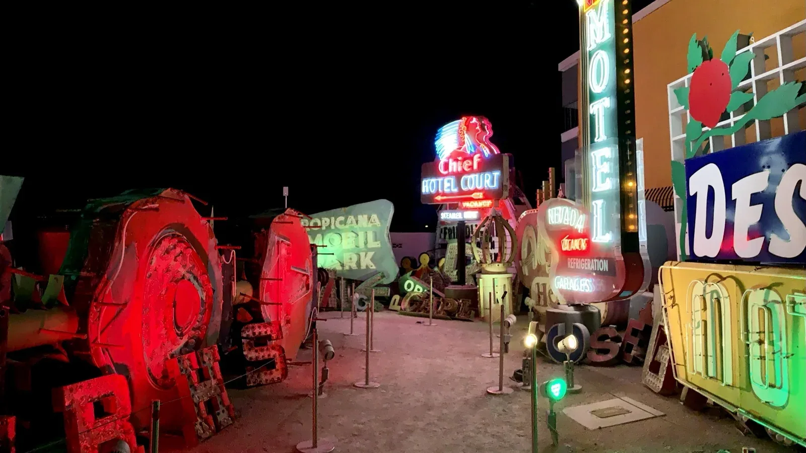 Neon signs lining a path at the Neon Museum in Las Vegas at dusk