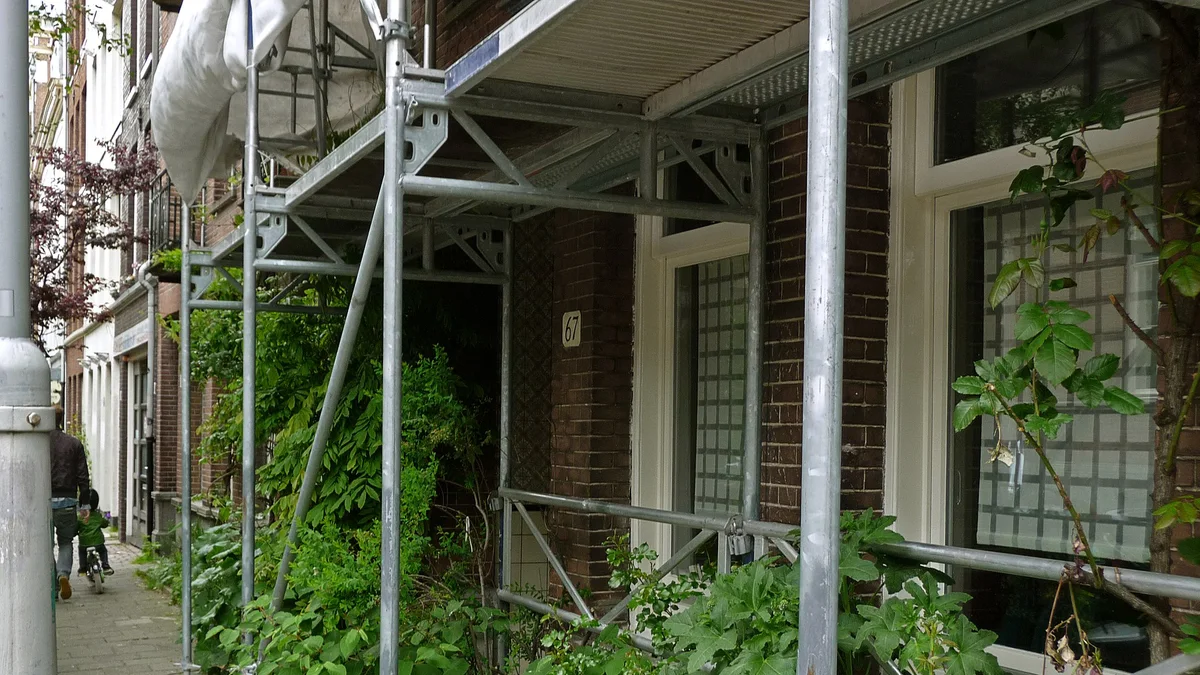 Scaffolding erected against a building undergoing restoration