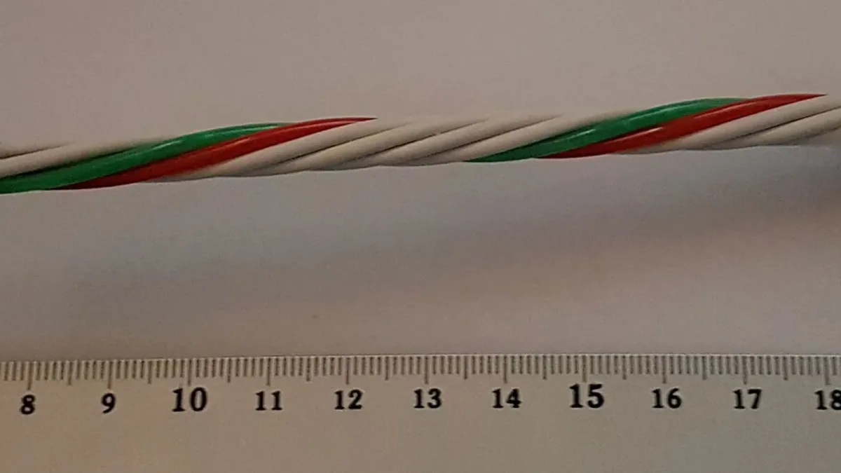 A fibre cable laid along a ruler for measurement