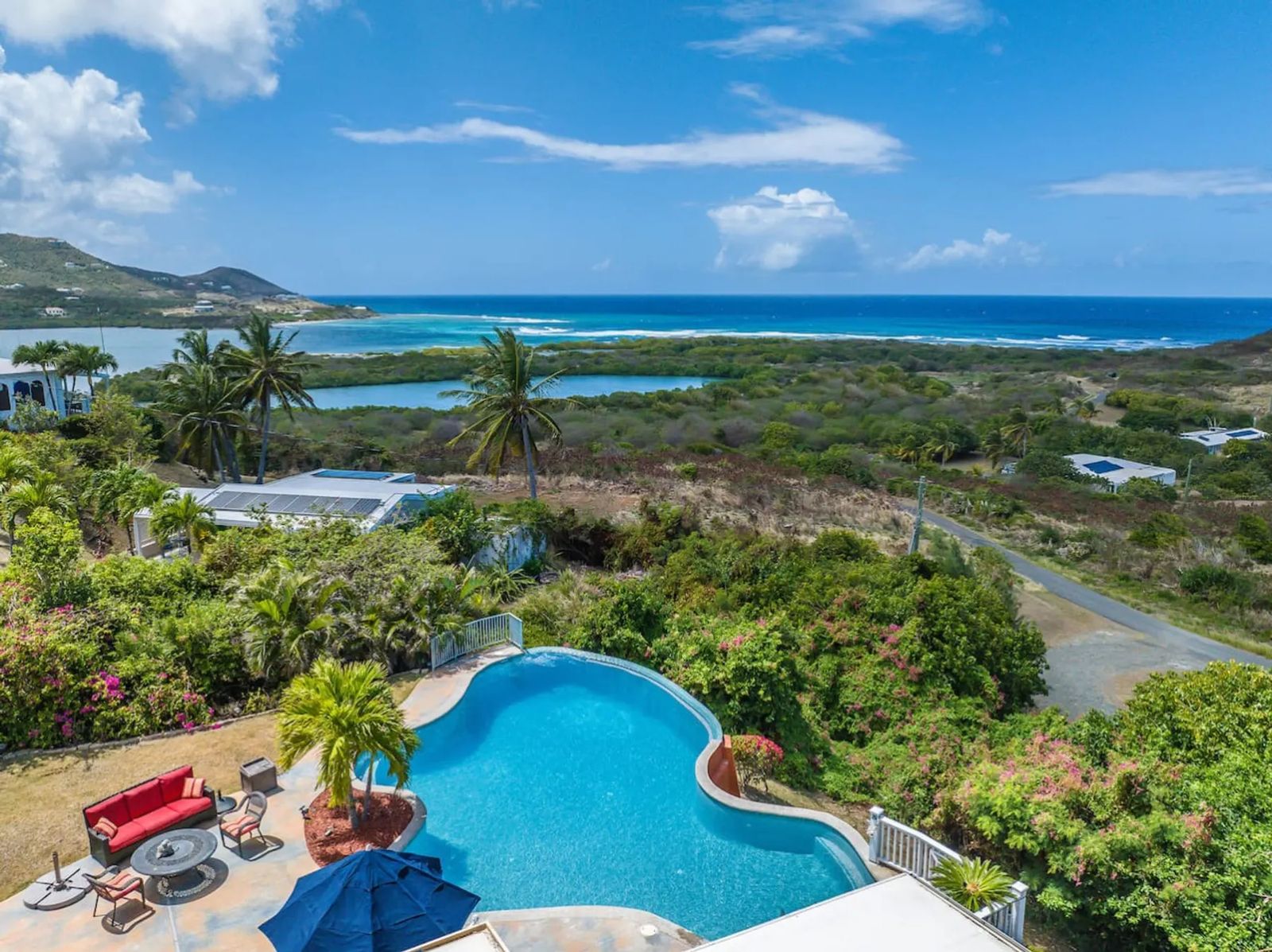 Hook ’em on Paradise — the pool from above, with the bay beyond