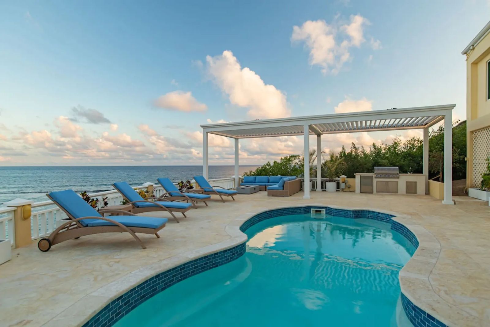 The Cerulean — the pool deck and pergola above the sea