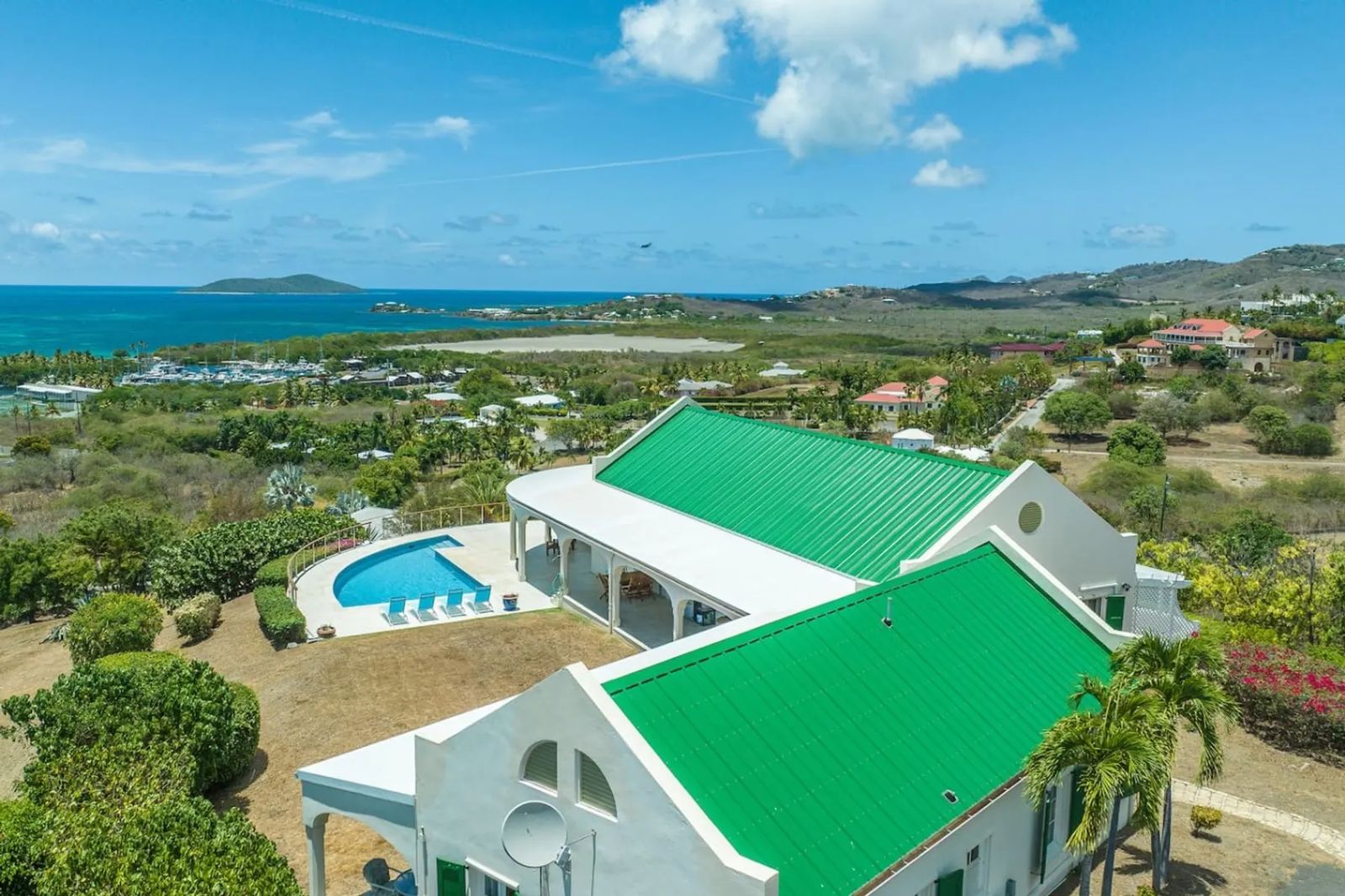 Buck Island Views — the villa, its green roofs and pool from the air