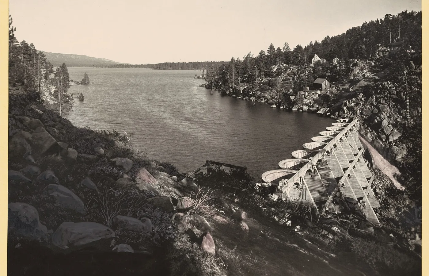 The forested shoreline of Big Bear Lake, the reservoir created by the 1884 Bear Valley Dam
