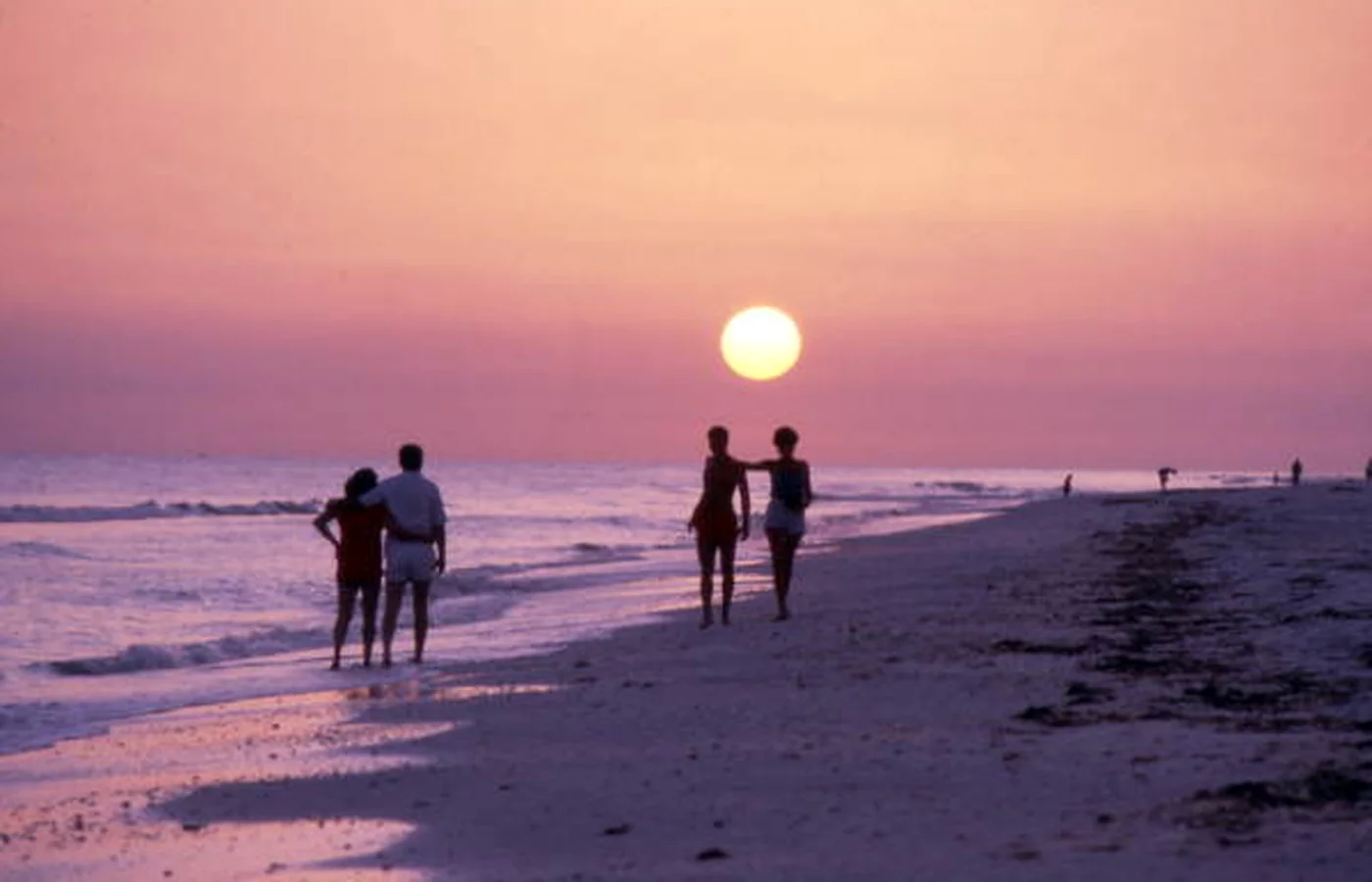 A historic photograph of a couple on the beach at sunset on Captiva Island, Florida