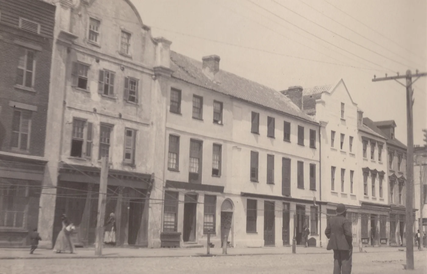 The row houses of East Bay Street in Charleston photographed in 1902, decades before their restoration as Rainbow Row