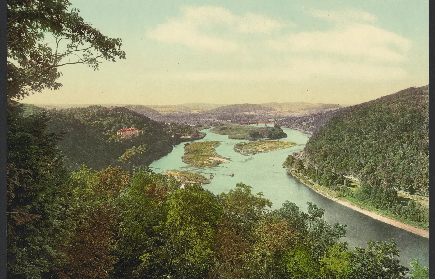 Photochrom print looking up the Delaware River from the Delaware Water Gap around 1900