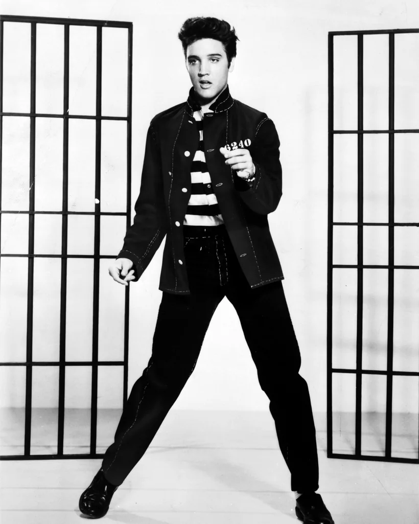 Elvis Presley in a 1957 MGM publicity photo; his 1961 film Blue Hawaii staged its wedding finale at Kauai's Coco Palms and sold the island's honeymoon business for decades