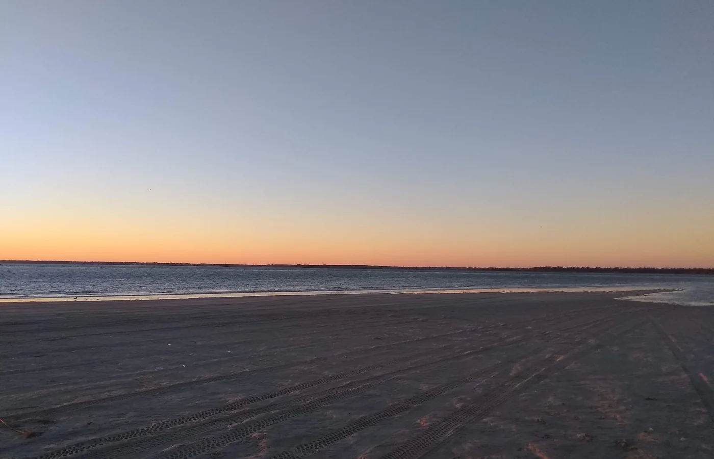 Sunset over the water at The Point, the western tip of Emerald Isle, North Carolina