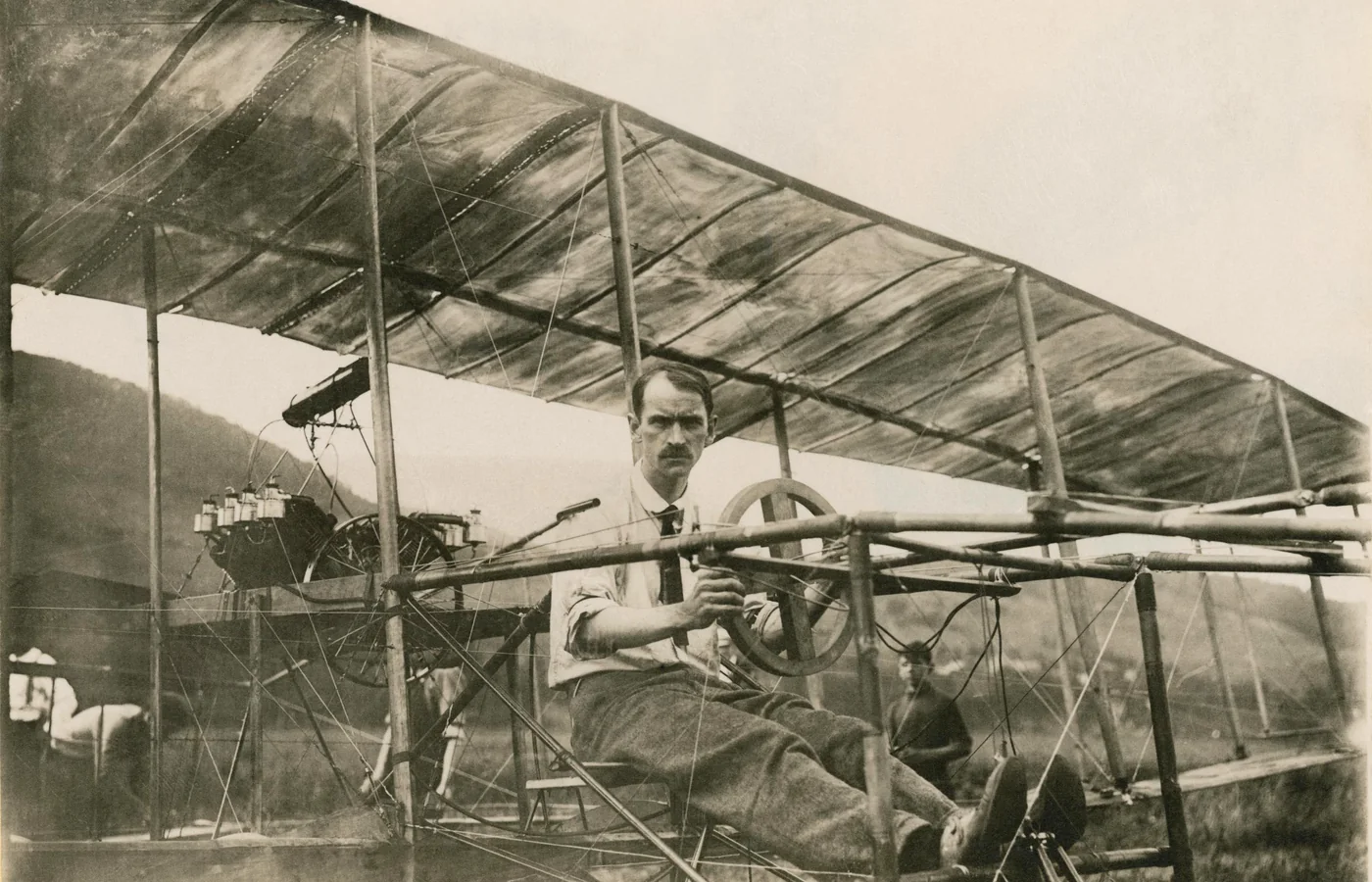 Glenn Curtiss seated in his biplane at Hammondsport, New York on July 4, 1908