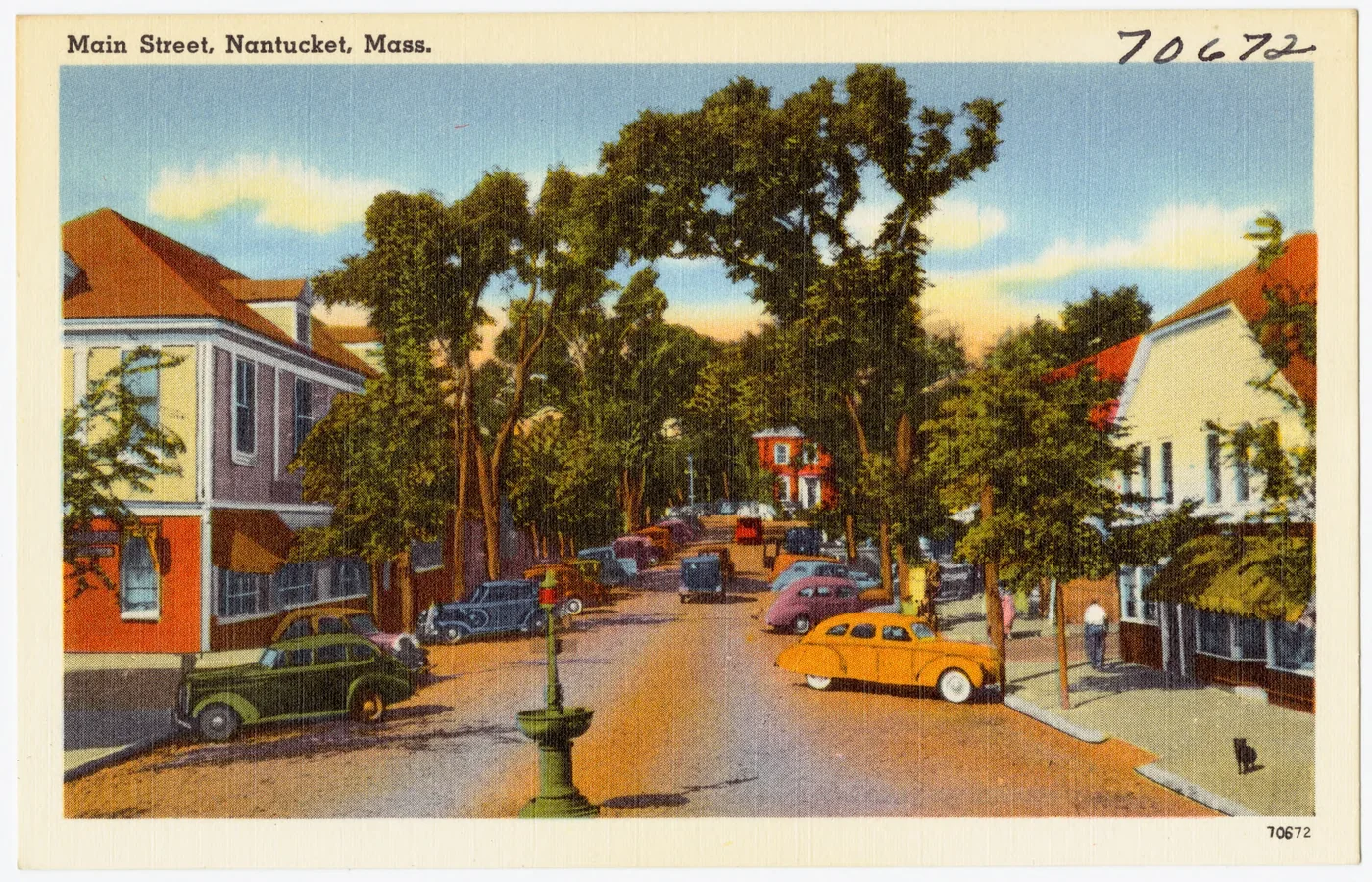 Postcard of cobblestoned Main Street in Nantucket, Massachusetts, lined with whaling-era buildings