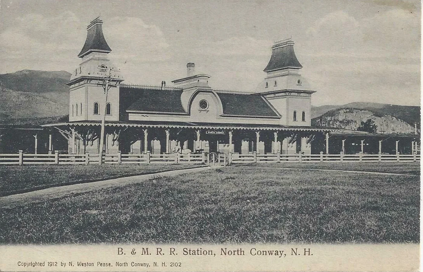 Postcard of the 1874 North Conway railroad station on the village green