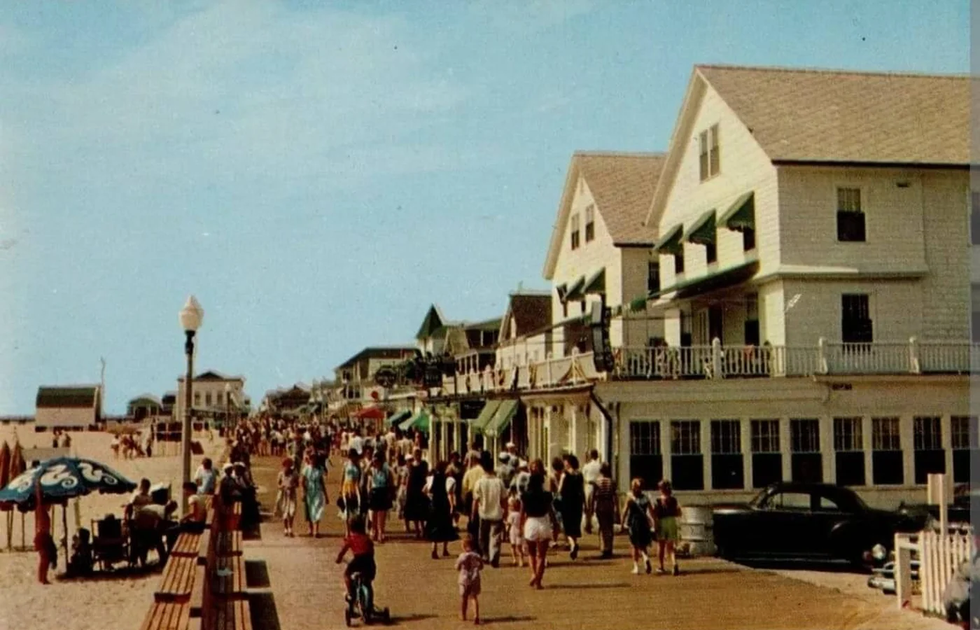 Vintage postcard of the boardwalk and hotels at Ocean City, Maryland, looking south