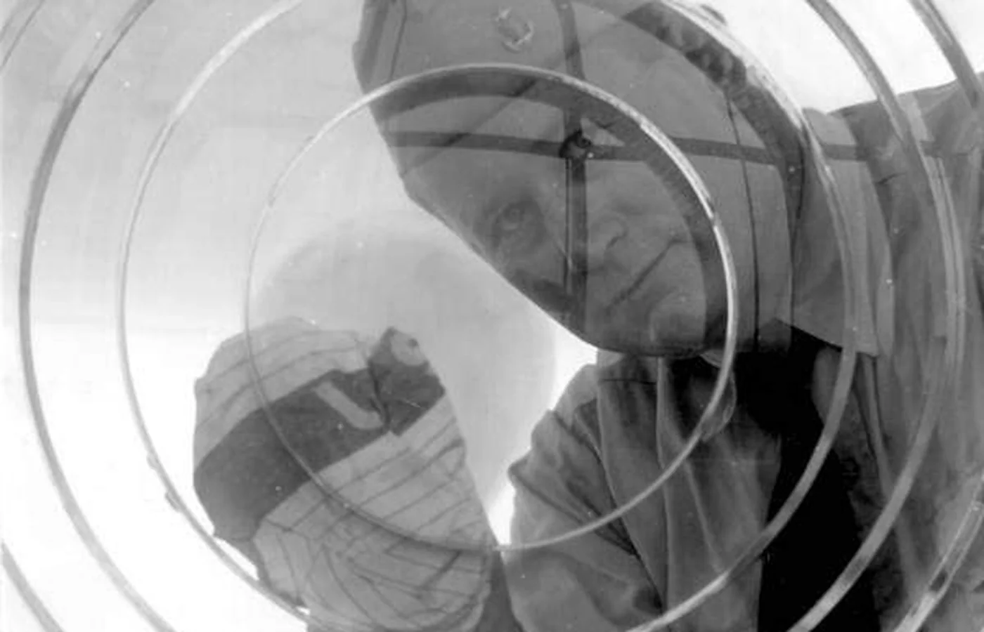 A lighthouse keeper cleaning the lens at the Pensacola Lighthouse, a historic Florida photograph