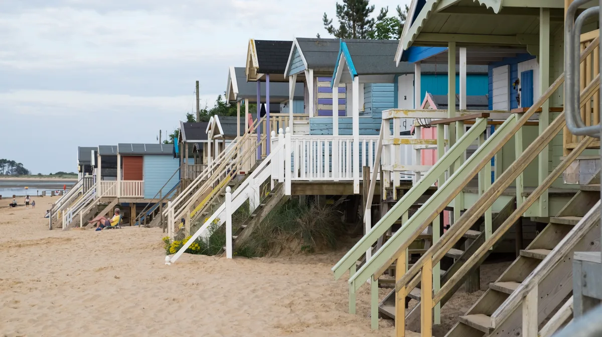 Beach huts on stilts above the sand at Wells-next-the-Sea, on the North Norfolk coast