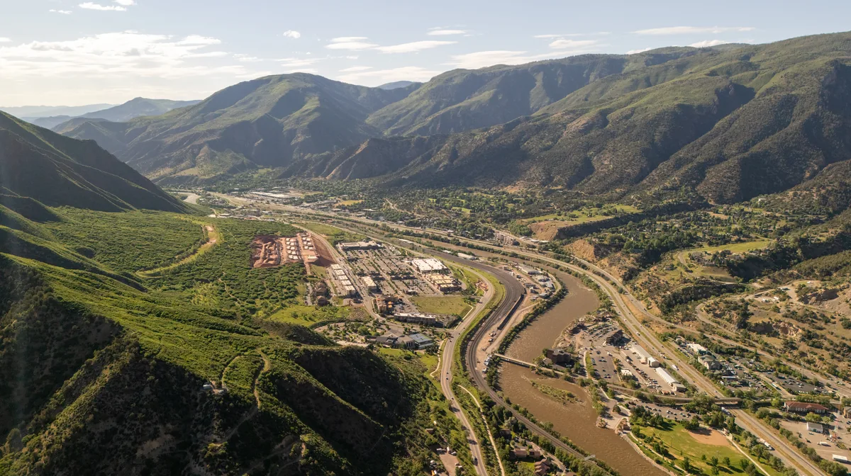 Glenwood Springs from the air, with the Colorado River winding through the valley, Colorado
