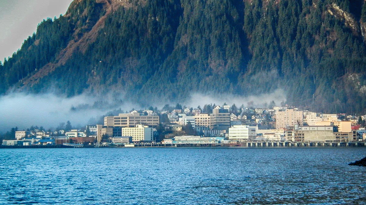Fog over the downtown Juneau waterfront and the mountain behind it, Juneau, Alaska