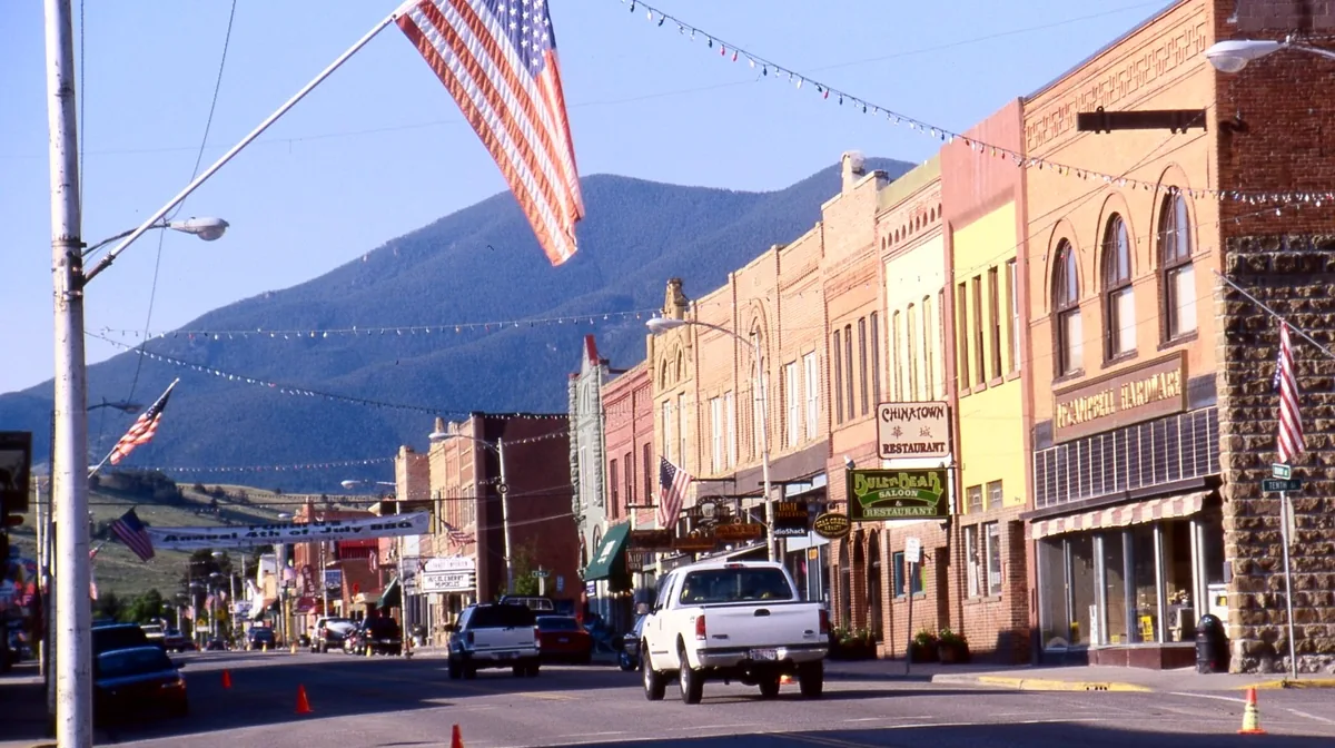 The historic main street of Red Lodge, Montana, with the mountains behind it