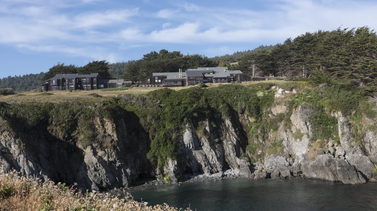 Sea Ranch houses on the bluff above a rocky cove, The Sea Ranch, California