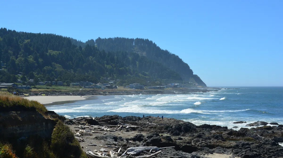Surf breaking on the rocky shore at Yachats, looking south toward Cape Perpetua, Oregon