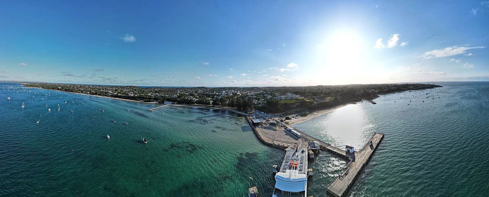 Aerial panorama of Sorrento with the SeaRoad ferry and Sorrento Pier. March — Mornington Peninsula airbnb marketing