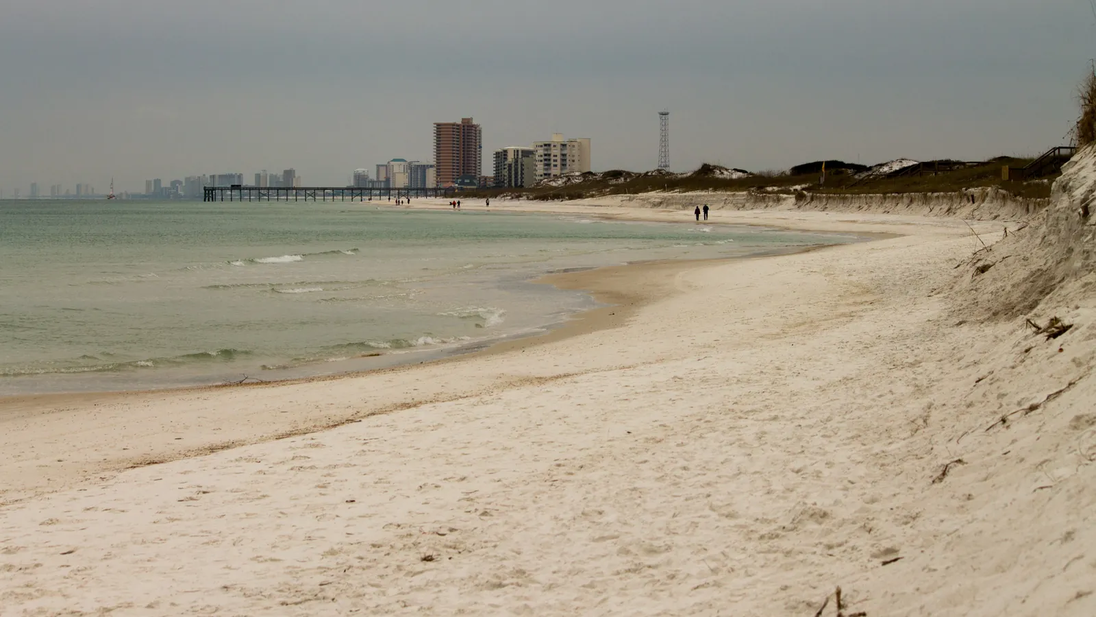 White sand beach at St. Andrews State Park looking toward the Panama City Beach condo towers