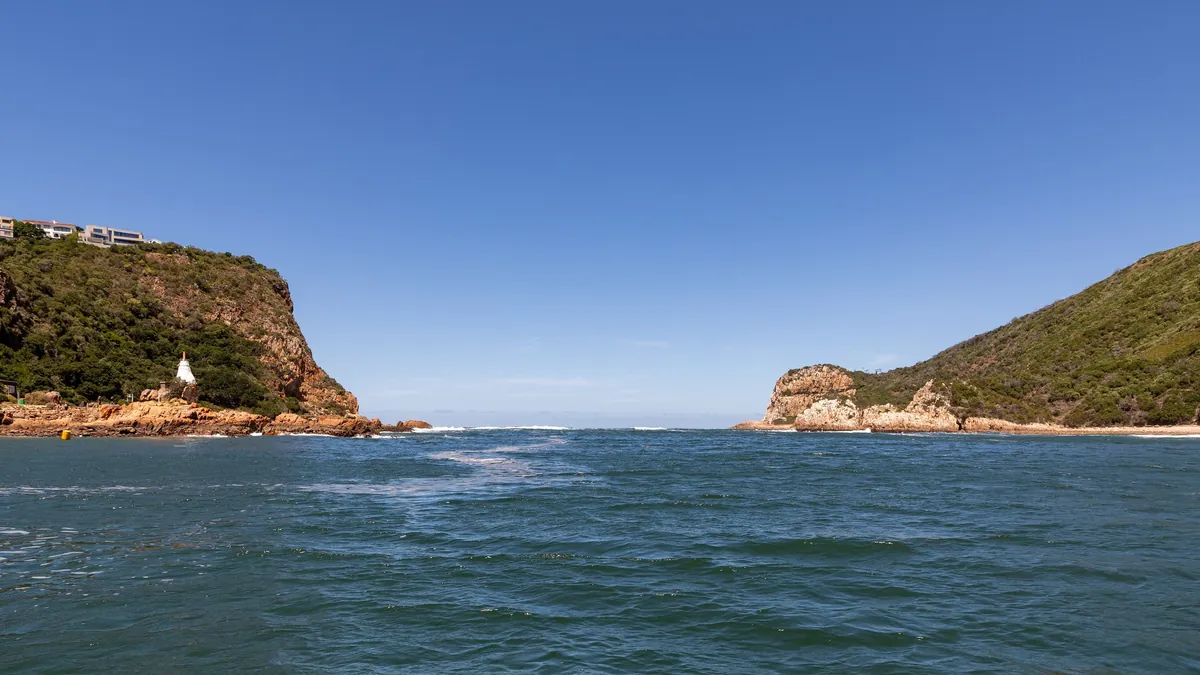 The East and West Heads at the mouth of the Knysna River, seen from the water at Knysna (a landmark, not the town centre)